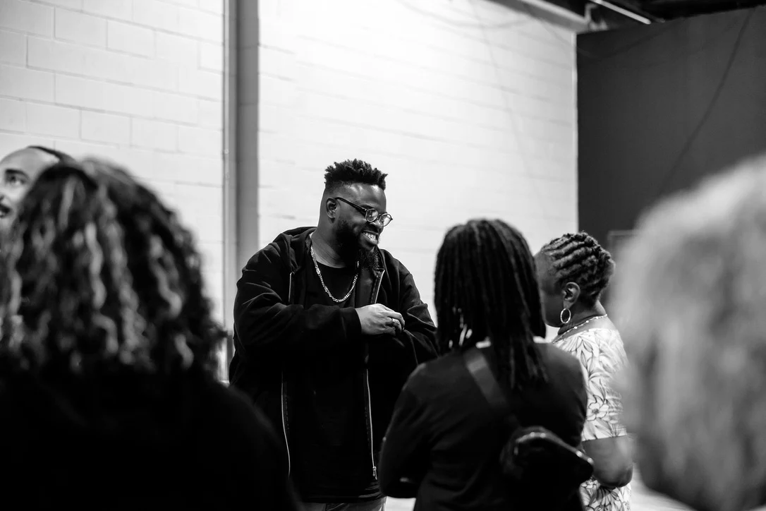Sheldon talking with guests after a session